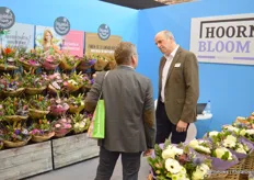 Peter van der Voort with Hoorn Bloemen talking to a visitor. The company produces bouquets for retail customers throughout Europe and specializes in providing variation every week.
